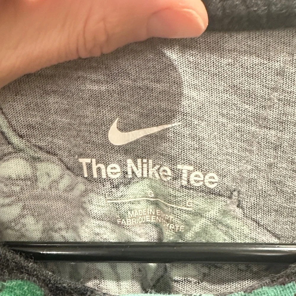 The Nike Tee men’s all over print black floral large floral basketball
